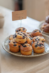 Blueberry muffins on the coffee shop countertop.  Selective focus.
