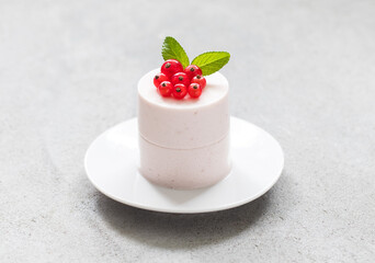 Vegan Red Currant Cream pudding cylindrical shape. Close-up