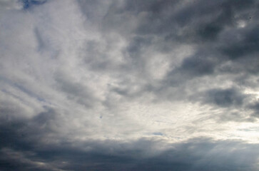 Fototapeta premium White passenger airplane flying in the sky amazing clouds in the background