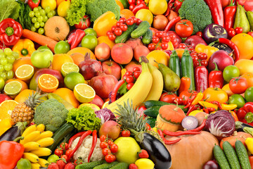 Assorted fresh ripe berries, fruits and vegetables. Food concept background.