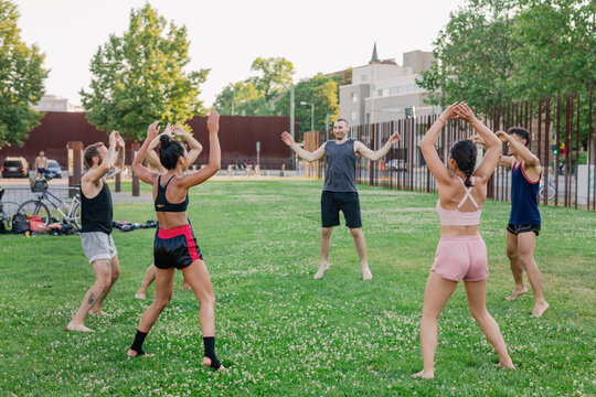 Group Muay Thai Training Outdoors - Jumping Jacks Warm-Up