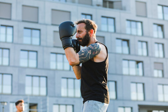 Muay Thai Fighter Practicing Shadow Boxing Outdoors