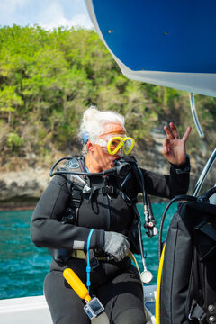 Diver woman on the deck of a boat
