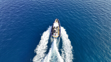 Aerial drone top down photo of  luxury inflatable rib speed boat cruising in mediterranean sea