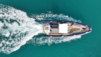 Aerial drone top down photo of  luxury inflatable rib speed boat cruising in mediterranean sea