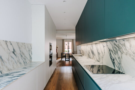 Modern kitchen with aquamarine cabinets