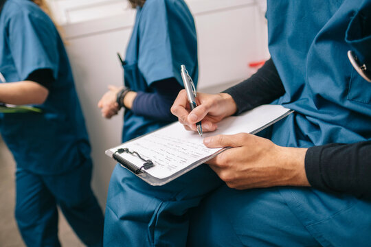 Veterinarian Taking Notes in Hospital