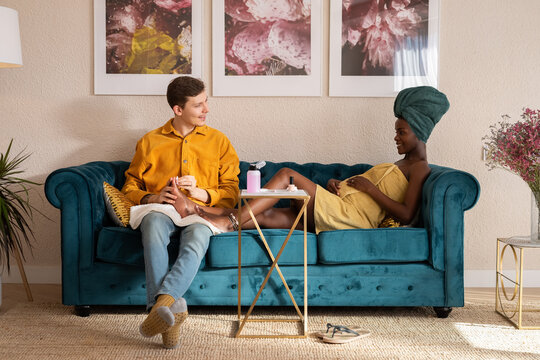 Multiracial couple enjoying time at home