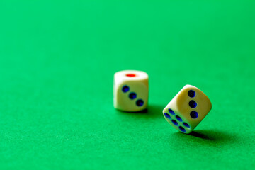 gaming dice on a rich green background. casino, betting and entertainment