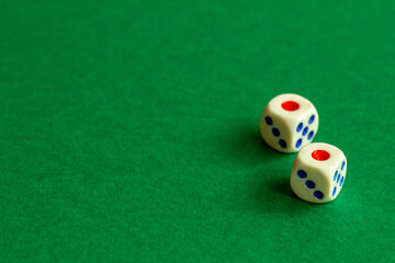 gaming dice on a rich green background. casino, betting and entertainment