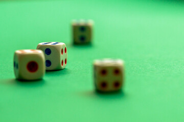 gaming dice on a rich green background. casino, betting and entertainment