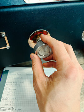 Adjusting the flame on coffee roaster