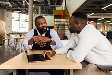 African American Businessmen Engaging in Serious Discussion