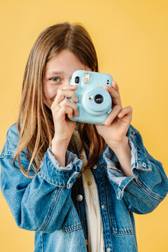 Pre teen girl taking a picture