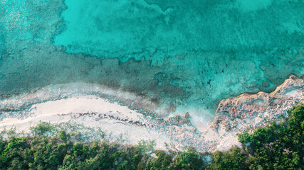 Drone shot overlooking sandy beach