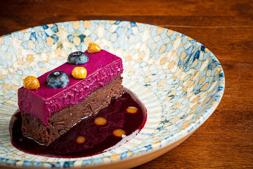 mousse cake with berries and sauce