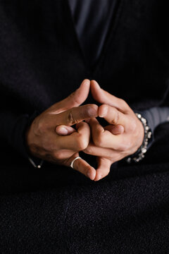 Faceless man doing mudra with hands