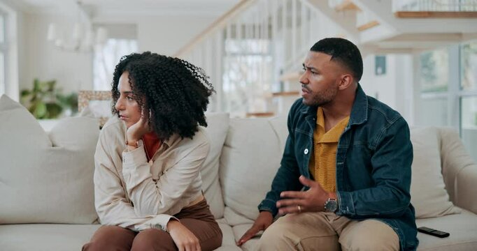 Black couple, talking and angry conflict in home, argument and communication in relationship. People, toxic marriage and fighting in living room, speaking and frustrated for issue or mistake and fail