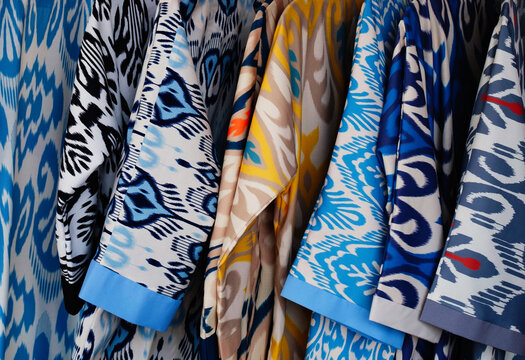 Traditional Ikat Textiles on Display in a Vibrant Market Stall 