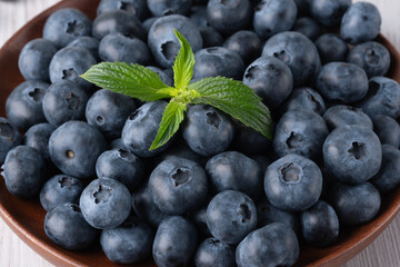 Fresh blueberries on a wooden white table
