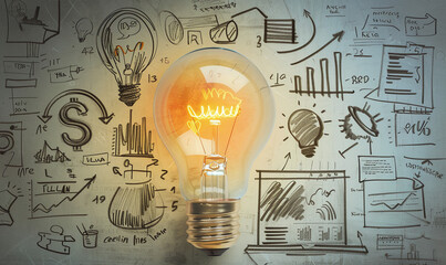 Illuminated Light Bulb with Business Sketches
