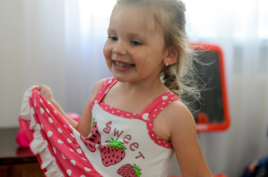 little girl laughing in the room