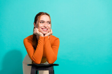 Portrait of pleasant woman with foxy hair wear crop top lean on chair look at sale empty space...