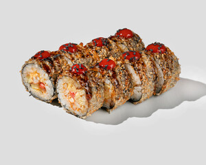 Close-up of crispy fried sushi rolls with spicy toppings, ideal for Asian cuisine concepts or Japanese holiday celebrations
