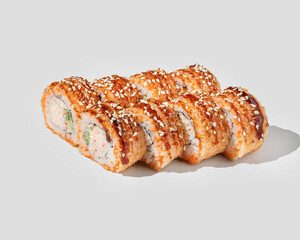 A delicious platter of sushi rolls topped with sesame seeds, perfect for celebrating Japanese cuisine or special occasions