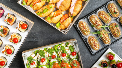 A flavorful assortment of gourmet canapes and finger foods, perfectly arranged for a festive holiday party or upscale event