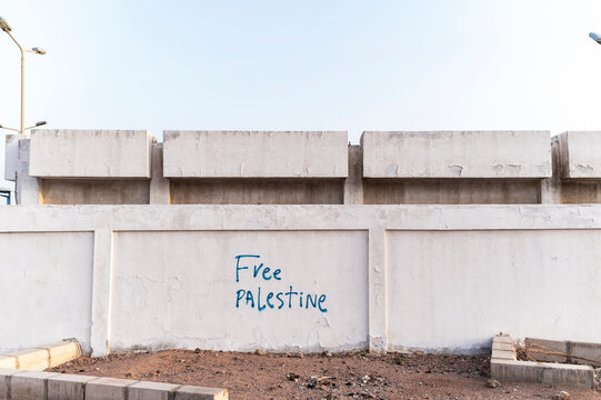 Free Palestine graffiti on white wall