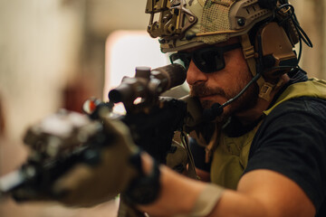 Close up of a warrior with weapon in action going on a mission.