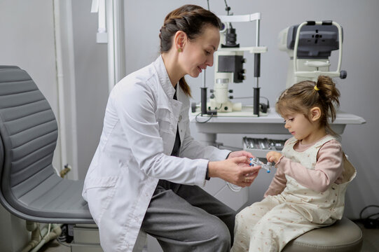 Girl getting eye exam at clinic,