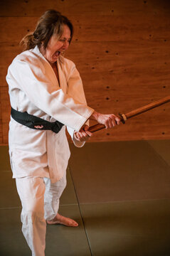 Woman yells while practicing sword play