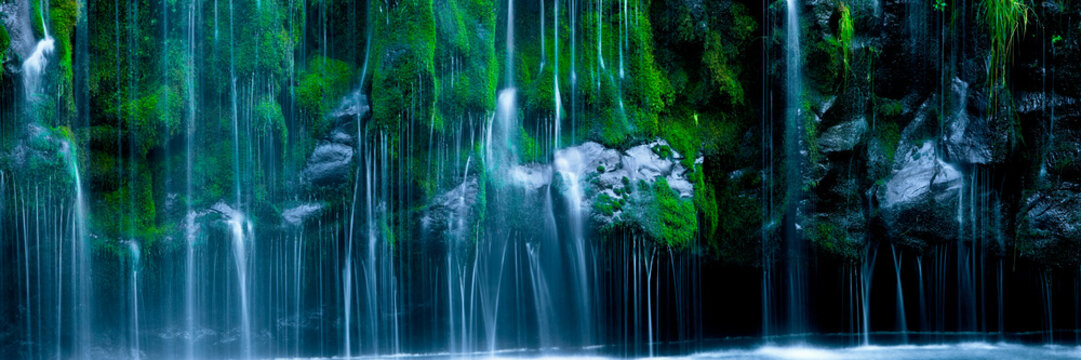 Lush waterfall with green foliage and granite rocks - Powered by Adobe