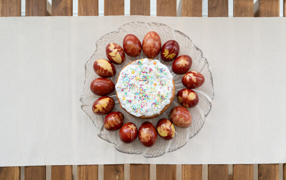 Coloured Eggs Around Easter Bread On The Plate