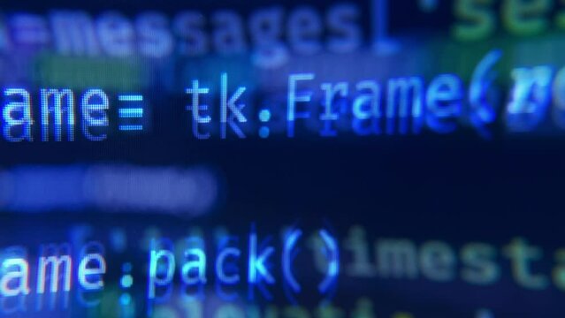 Lines of code. Close up of a screen showing lines of code scrolling fast.
