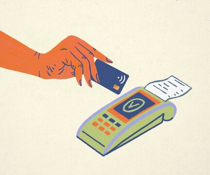Hand Holding A Credit Card near payment terminal

