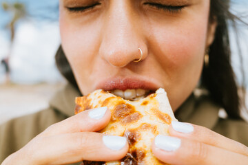 Woman Enjoying Delicious Empanada