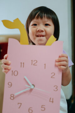 portrait of a child with broken clock 