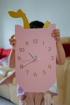 portrait of a child with broken clock 