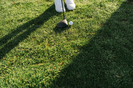  legs of young woman playing golf in the sun 