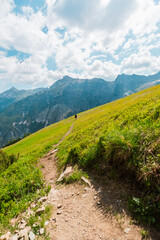 Fototapeta premium Paraglider with Backpack Walking to Departure Flying Spot