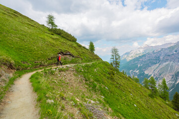 Hiking Path with Hiker Along a Steep Mountain Hillside
