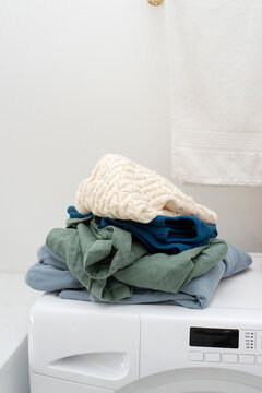 Banch of clothes on washing machine