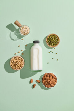 Vegan milk from nuts in a glass jar with various nuts