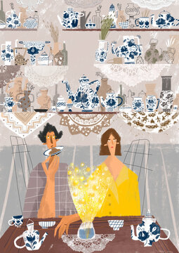 a couple sitting in the kitchen drinking tea 