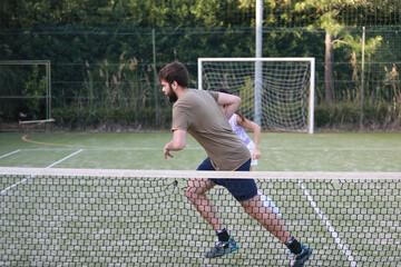 Fototapeta premium Coach And Tennis Student Running Together 