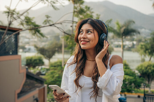 Woman Listening Music with Headphones