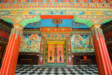 Colorful interior of a Buddhist temple with traditional frescoes